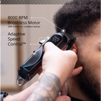 Person using a Wahl hair trimmer with text highlighting features on a neutral background